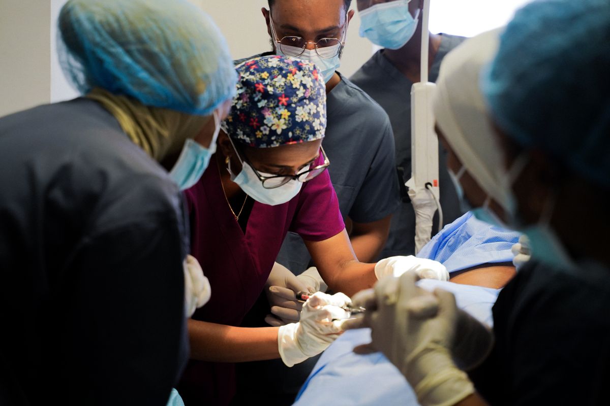 doctors inspecting someone's skin
